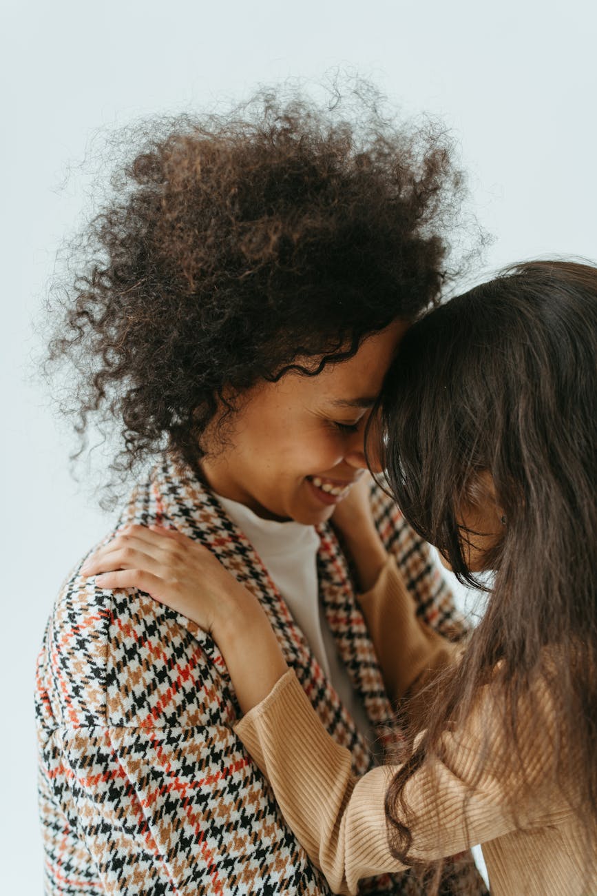 photo of a woman and her daughter head to head