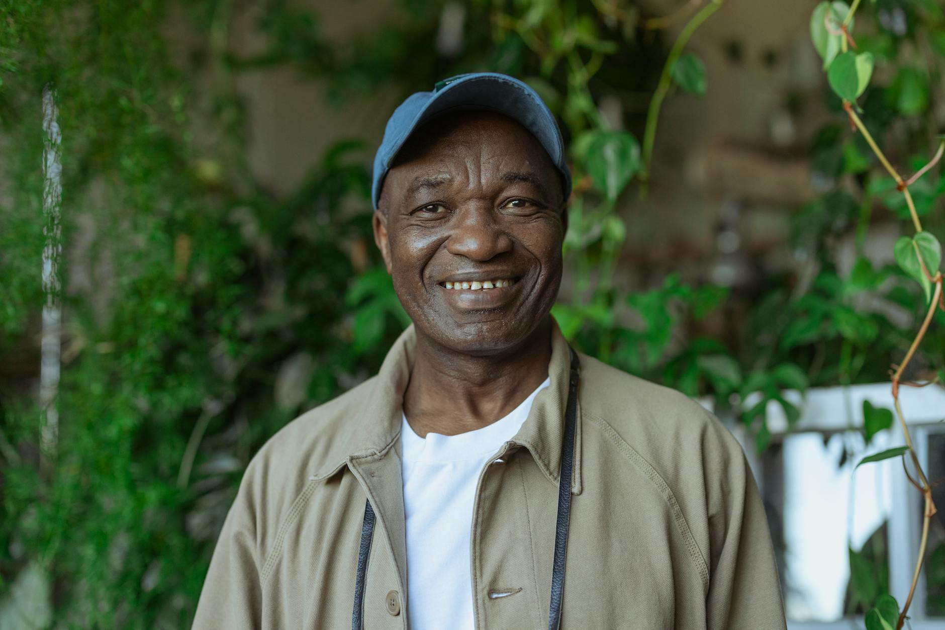 photo of old man wearing blue baseball cap
